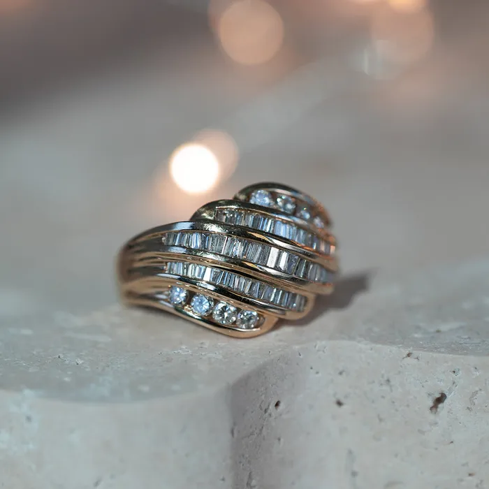 Consider the Wldflwrs Rings Diamond and Baguette Swirl Ring